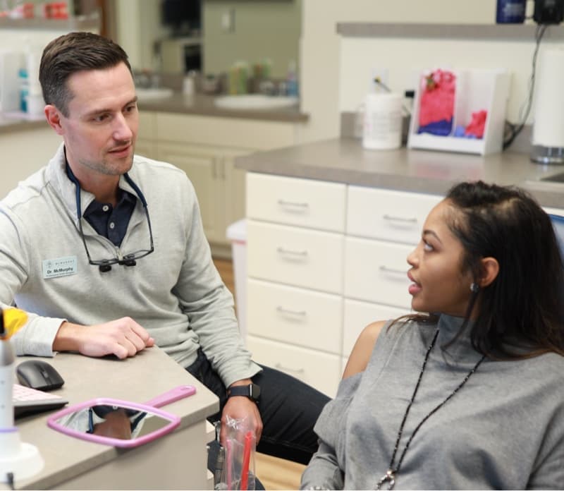 adult patient and doctor smiling