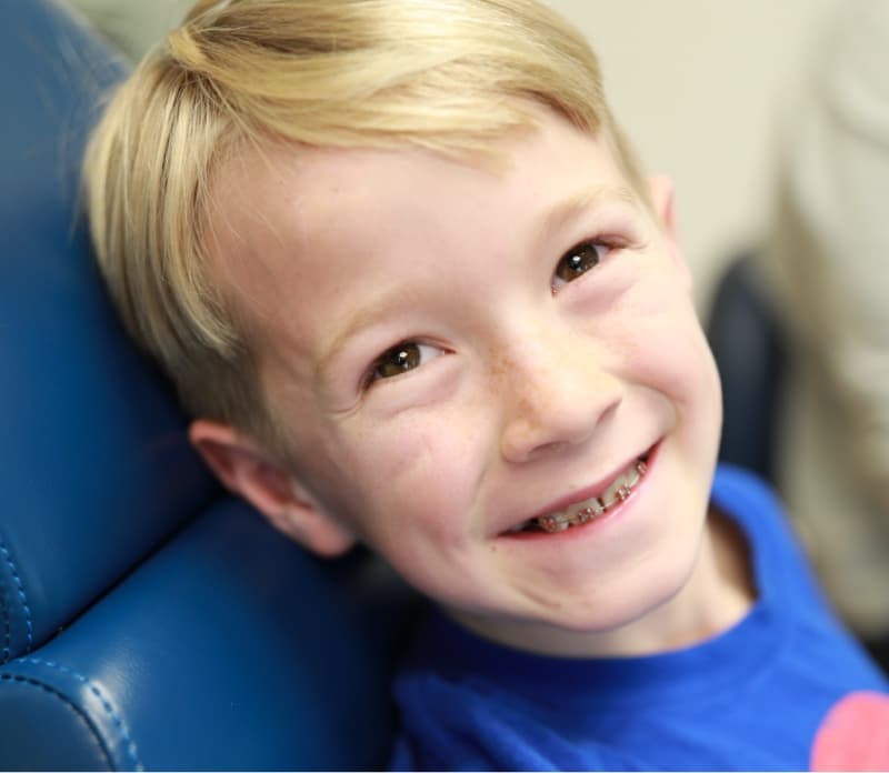 young patient smiling wearing braces